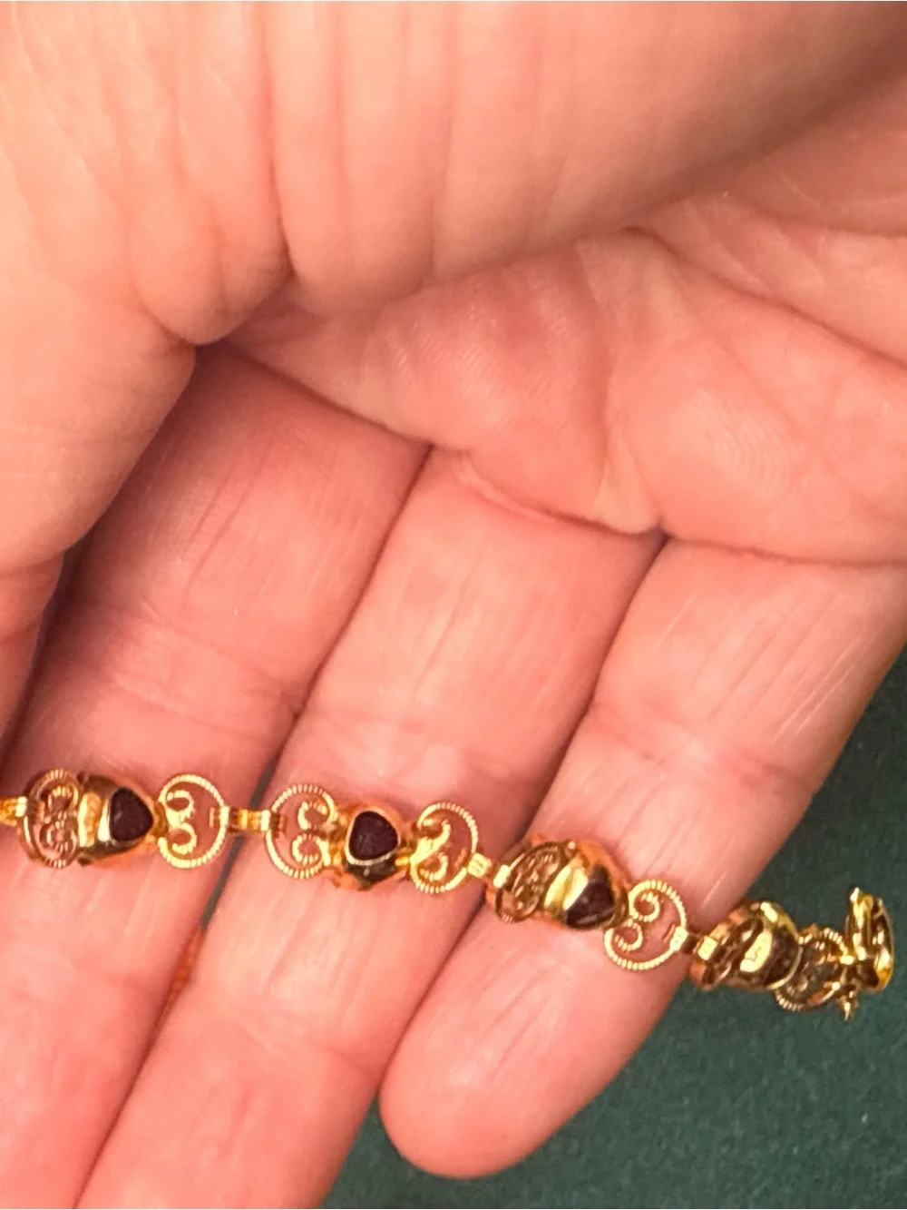 Source Unknown Gold Tone Bracelet with Deep Red Heart Stones